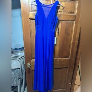 Cobalt blue evening gown. Never worn, tags attached. Size 5. Stretch material.
